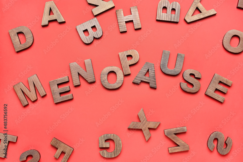 Word MENOPAUSE and letters on red background