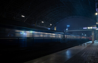 train at the station in the night fog