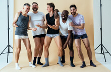 Group Of Multiethnic Men Posing For A Male Edition Body Positive Beauty Set. Guys With Different Age, And Body Wearing Boxers Underwear