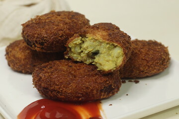 Wall Mural - Deep fried Chicken Cutlets. A flat croquette of minced meat covered in bread crumbs and fried