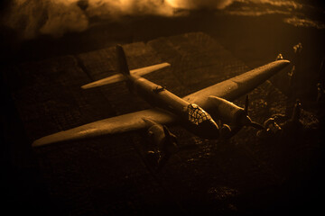 Wall Mural - German Junker (Ju-88) night bomber at night. Artwork decoration with scale model of jet-propelled plane in possession. Toned foggy background with light. War scene.