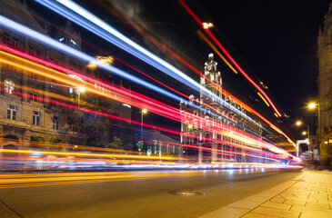 Wall Mural - The blurry lights of city traffic. Budapest, Hungary. Evening illumination of the building. High resolution photo.