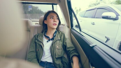 Canvas Print - Asian beautiful woman traveler sitting in the car while travel in city. 