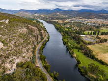 High Angle Aerial Drone View Of River Derwent, One Of The Major Rivers On The Island Of Tasmania, Australia, Near The Town Of New Norfolk, 30 Kilometres From Tasmanias Capital City Hobart.	