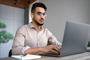 Man typing on keyboard using computer and internet for job or communication