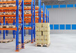 Logistic warehouse. Warehouse courier service. Delivery service logistics center. Pallet with boxes near racks. Empty shelving with wooden flights. Warehouse distribution of courier orders. 3d image.