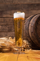 Beer barrel with beer glasses on a wooden table