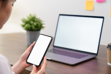 Aufkleber - Woman hand holding smartphone and touching blank screen. Mockup of advertisement.