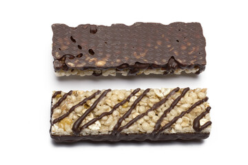 two chocolate banana cereal bars white background