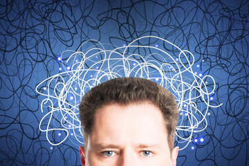 Poster - Portrait of attractive young european man with abstract scribble on blue background. Question, think and confusion concept.