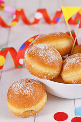 Wall Mural - German traditional 'Berliner Pfannkuchen', a donut without hole filled with jam. Traditional served during carnival.