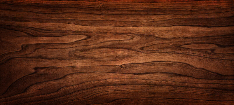 Wall Mural - Walnut tree texture close up. Wide walnut wood texture background. Walnut veneer is used in luxury finishes.