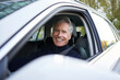 © Westend61 - Happy senior man sitting in car