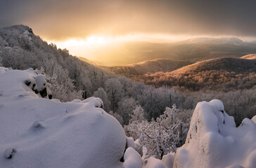 Wall Mural - Panorama sunset colored sky winter snow clouds in Slovakia nature landscapes. Mountain sunset sky zoom in peak Vapenna frost.