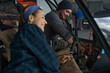 © Svitlana - Bearded man and laughing woman working together in airplane cockpit in hangar