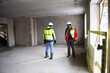 © Zelma - The architect of the building project and the construction manager walk around the interior of the new building