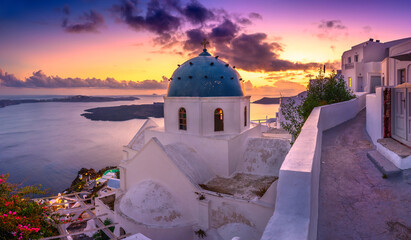 Fantastic Sunset night view of traditional Greek village Fira on Santorini island, Greece, Europe. luxury travel. famous travel landscape. Summer holidays. Travel concept background.