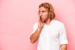 © Asier - Young caucasian man isolated on pink background being shocked because of something she has seen.