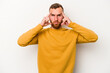 © Asier - Young caucasian man isolated on white background focused on a task, keeping forefingers pointing head.