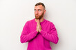 © Asier - Young caucasian man isolated on white background praying, showing devotion, religious person looking for divine inspiration.