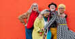 © Jacob Lund - Vibrant senior citizens having fun against a red background