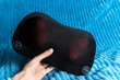 © Алексей Филатов - Electric vibro massage pillow for neck. Relaxing massage, device health concept, selective focus