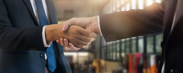 Wall Mural - Successful deal and negotiate job, businessman handshake and shake hand with investor partner, success of discussion and financial agree partnership