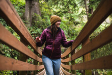 Solo Female Traveler Exploring Nature Trails In Oregon