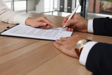 Sticker - People working with Real Estate Purchase And Sale Contract at table indoors, closeup