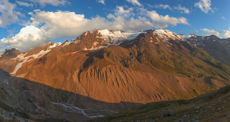 Wall Mural - Sunset that colors of red the moraines of the rapidly retreating glaciers surrounding the Palla Bianca, Alto Adige - Sudtirol, Italy. Popular climbers destination