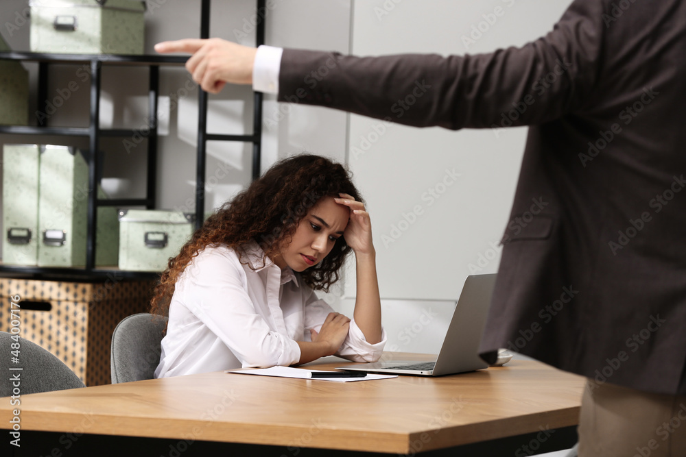 African American woman suffering from racial discrimination at work ...