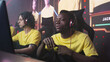 © Framestock - Nervous African American cyber esportsman warming up fingers and speaking with teammates at start of professional gaming competition