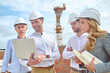 © zinkevych - Construction engineer showing something to his colleagues on his laptop
