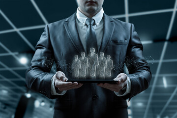 Wall Mural - Businessman showing holograms of human resources icons on tablet.