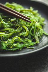 Wall Mural - Green wakame. Seaweed salad.