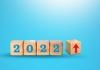 Canvas Print - Wooden blocks with new year 2022, arrow up icons, Business development and growth concept