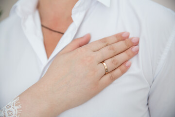 Wall Mural - Bride's hand with wedding ring on his shoulder groom