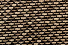 Brown And Yellow Woven Fabric Texture Closeup.