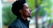Man exhaling smoke from cigarette outdoors