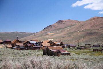 The beautiful ruins of the gold rush city of Bodie with the mountains and the desert