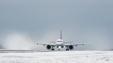 Passenger Plane Takes Off From The Runway In The Winter In A Slow Motion 4K Video