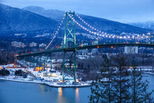 View Of Lions Gate Suspension Bridge In Vancouver, British Columbia, Canada At Night In Winter Full Of Lights