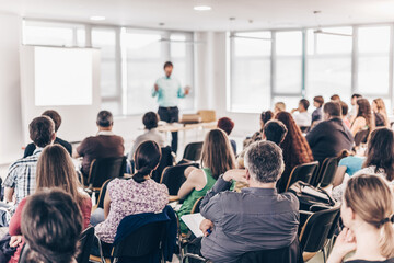 Wall Mural - speaker giving presentation on business conference lecture.