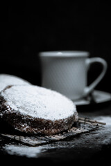 Poster - A vertical shot of cookies with coconut flavor next to the coffee cup