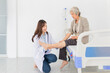 © jokekung - asian female doctor holding leg of old stroke patient in hospital, elderly rehabilitation clinic, they training to rehab muscle, Knee Replacement, Osteoarthritis of the Knee