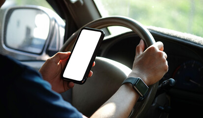 Wall Mural - close up shot of man using smartphone in car.
