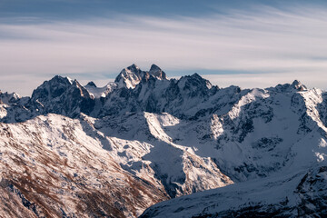 Wall Mural - Snowy mount Ushba. Greater Caucasus ridge. Sunny day. Before suset. View from russian side