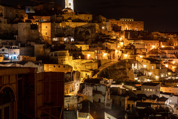 Wall Mural - Night landscape of the Sassi of Matera, well-known for their ancient cave dwellings. Basilicata. Italy