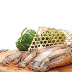 Poster - freshly caught squid and green pepper on white background