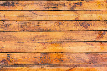 Top view flat lay stock photography of organic bright orange and brown wooden surface of floor wet from raindrops. Outdoors terrace of cottage and rainy weather concept. Abstract wood background